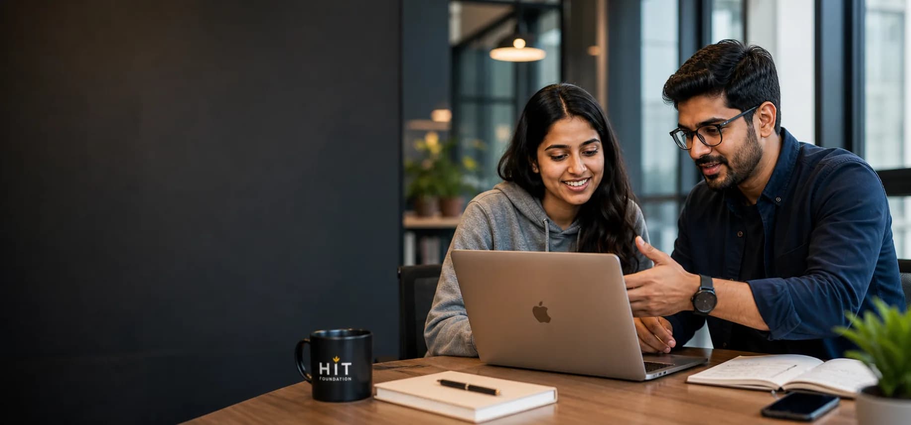 Arun Prakash working with mentors on an AI project
